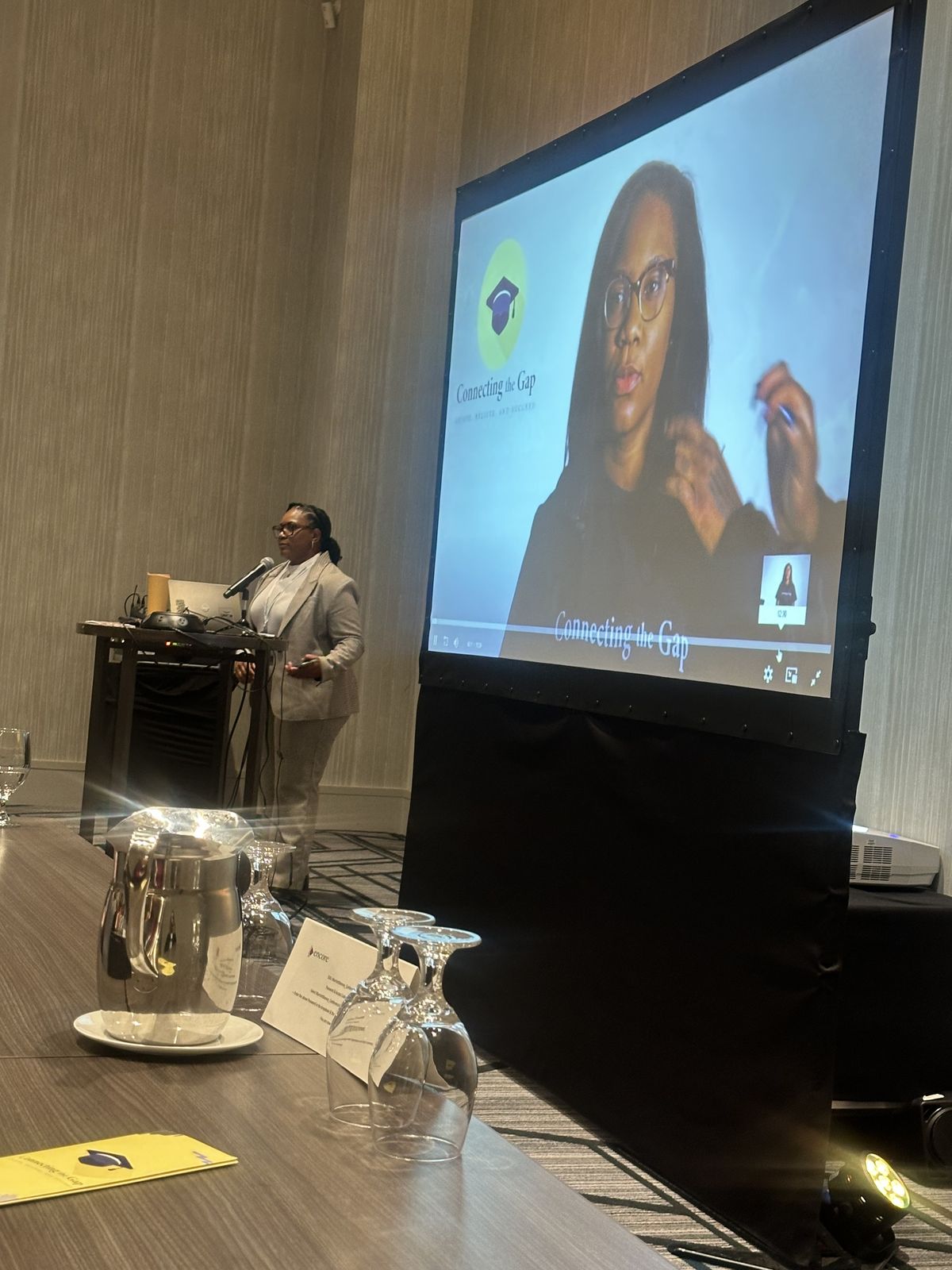 Quaneka Falls at the Connecting the Gap presentation at a formal event